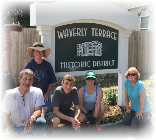 Five Waverly Terrace members working on entrance sign